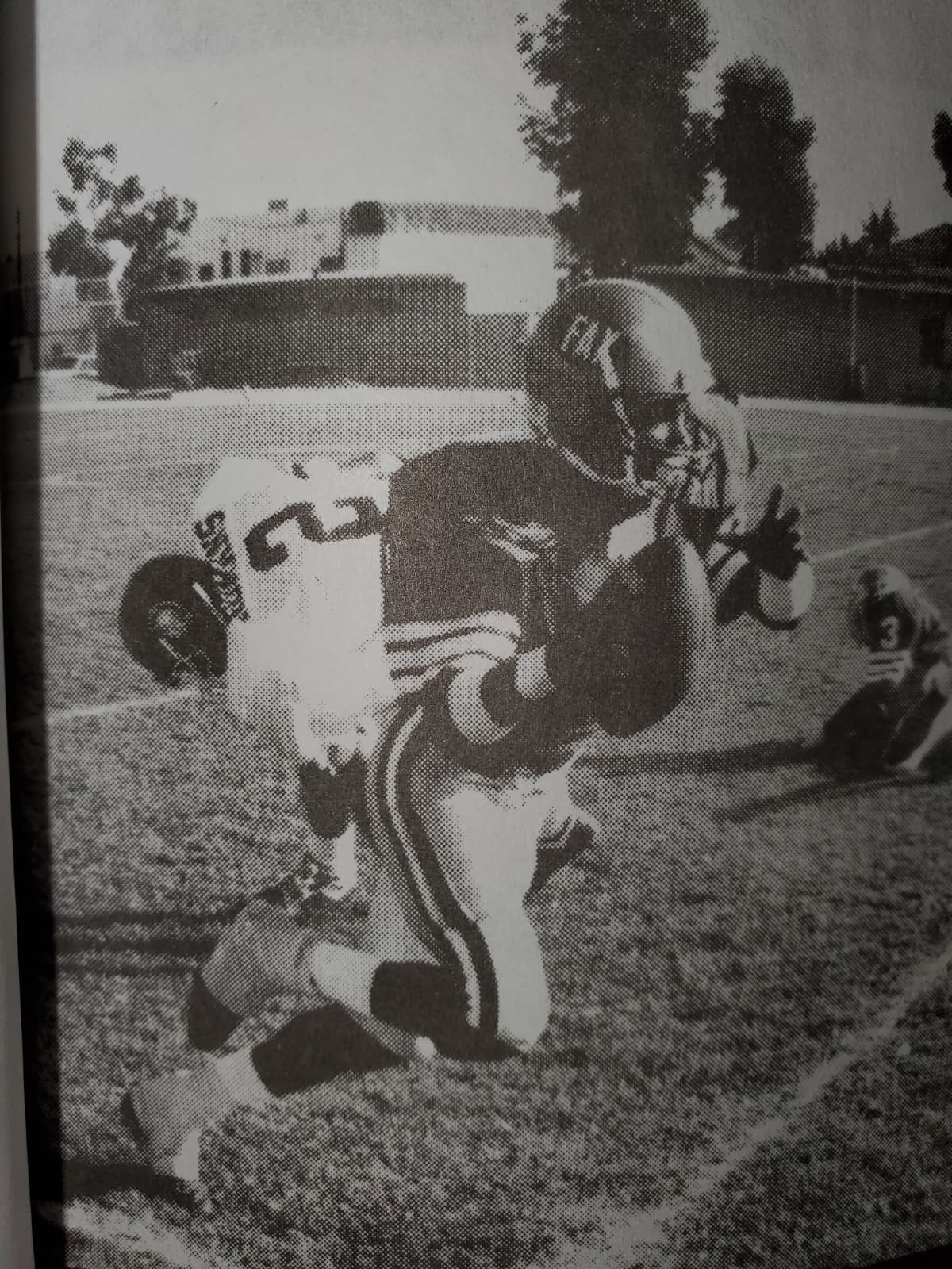 A young Coach Todd (No. 2) carrying the ball as an all-city football player for Fairfax High School