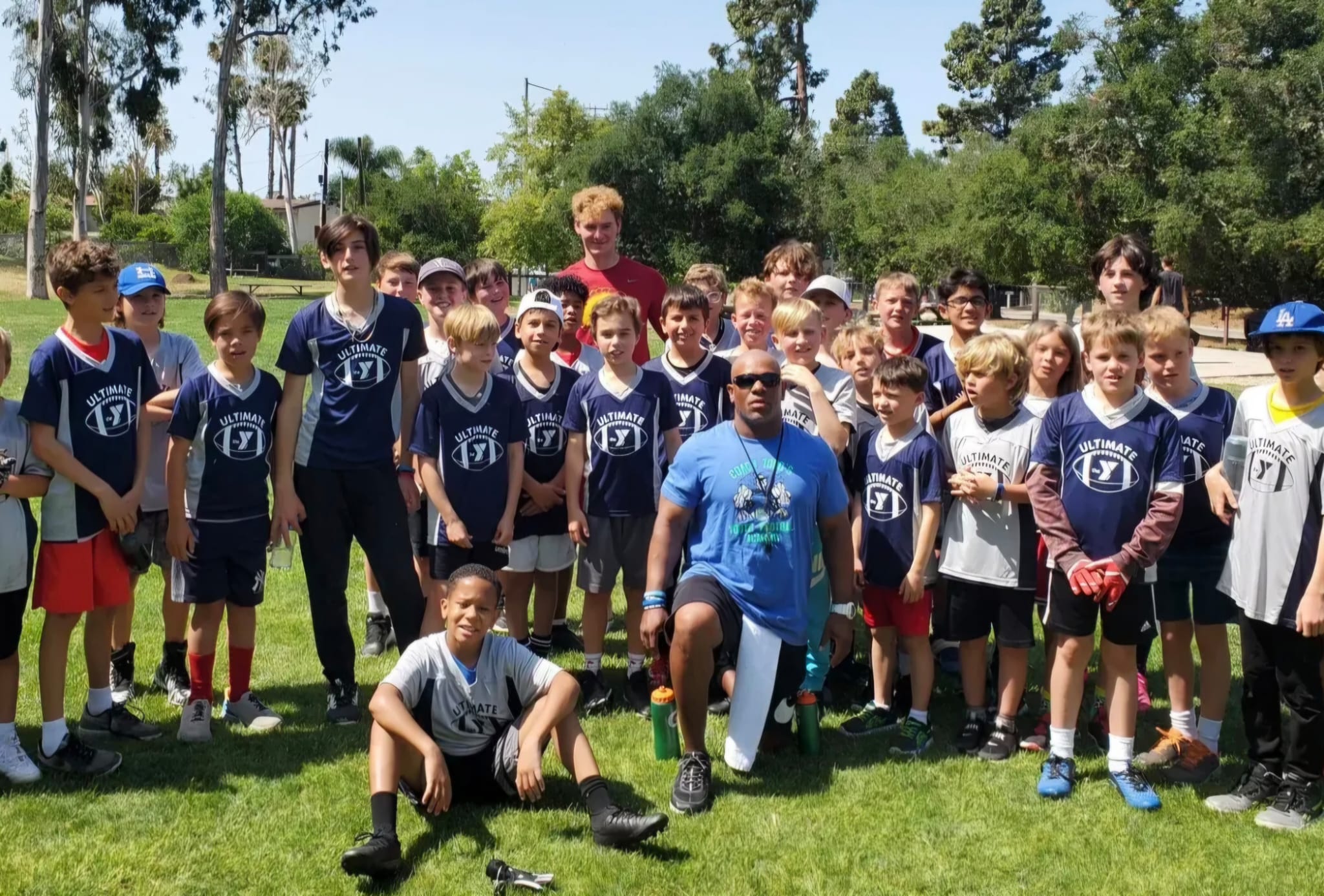 Coach Todd with youth football campers